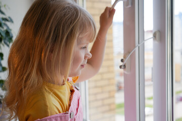 safety at home for small children. a lock on the window protects children from opening the window....