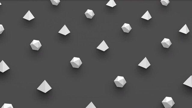 Futuristic 3d render of pyramid and platonic isoca shapes with random rotating effect in isometric view. Computer generated loop animation. 4K seamless motion design