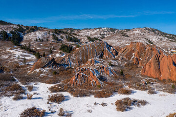 amazing snow topped red mountain peaks at a state park in utah or colorado during the winter on...