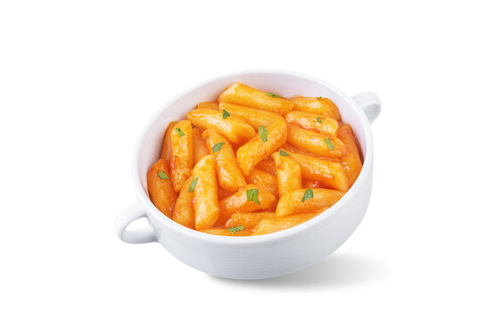Tteokbokki. Traditional korean rice sticks in hot spicy sauce on a white isolated background