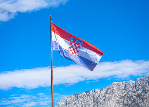 Croatia flag over Balkans Mountains . European country flag 