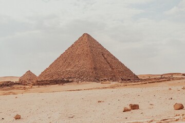 Majestic Pyramids of Egypt rise proudly against the vast desert landscape, a timeless testament to ancient civilization's architectural brilliance