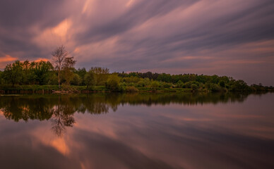 Long exposure fantastic sunset view on Bartatov Bartativ, Morozy village region Lviv. Lake and forest. Lviv district, Ukraine. May 2020