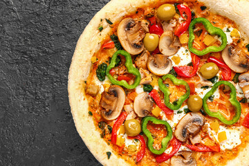 Vegetable pizza on dark background