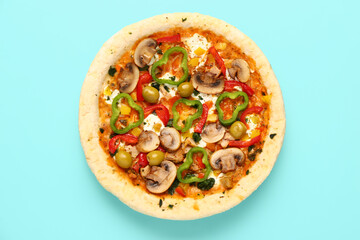 Vegetable pizza on blue background
