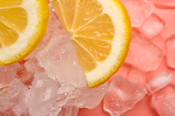Sliced fresh lemon and ice on pink background