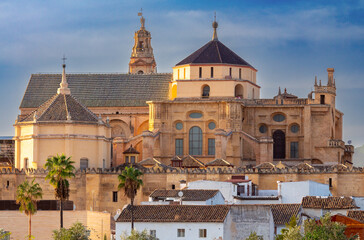 Fototapeta na wymiar The majestic Mezquita Cathedral against the blue sky. Cordova.