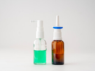 Two glass bottles of nasal sprays