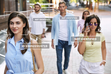 Facial recognition system identifying people on city street. Woman and her personal data
