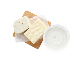 Tasty tofu and cream cheese on white background, top view