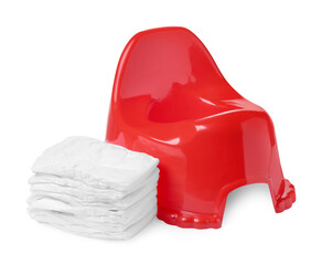 Red baby potty and diapers on white background. Toilet training
