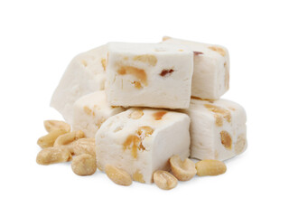 Pieces of delicious nougat and nuts on white background