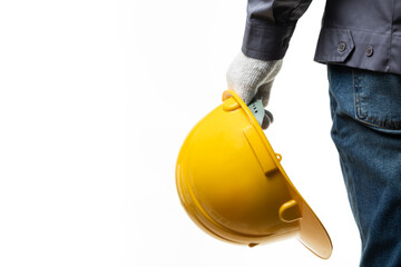 Man holding yellow helmet on white background. Close-up