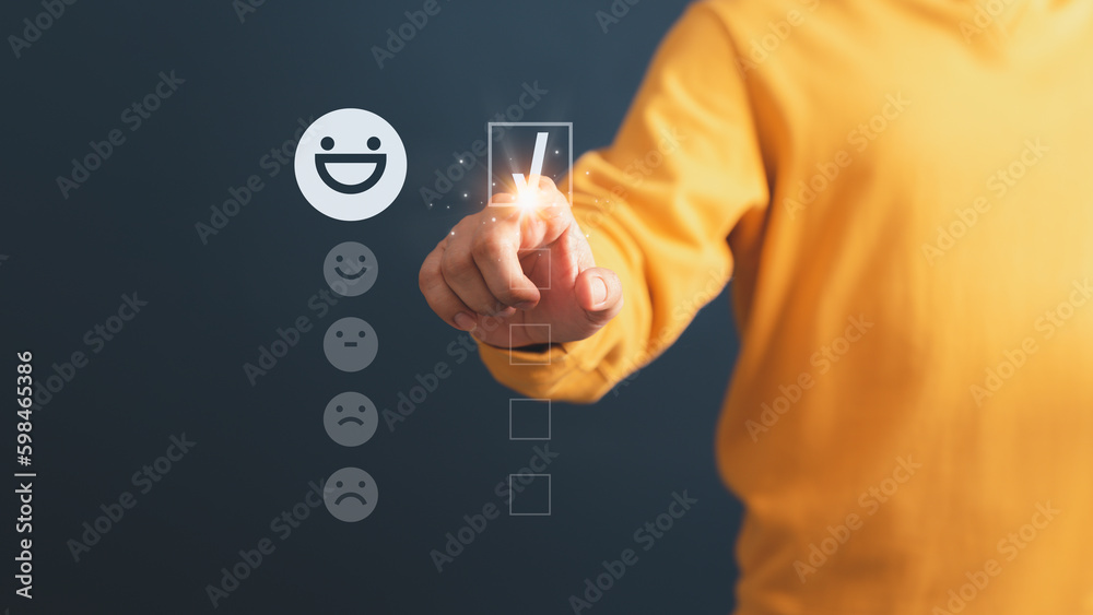 Poster client hand are touching the virtual screen on the happy smile face icon to give satisfaction in ser
