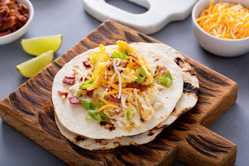 Breakfast tacos with hash browns, eggs and bacon