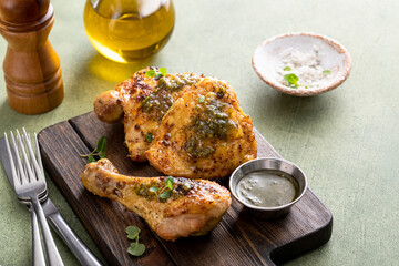 Roasted lemon and herb chicken drumsticks and thighs - obrazy, fototapety, plakaty
