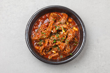 Chicken feet seasoned with vegetables.