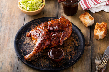 Barbeque smoked half chicken with salad and toast