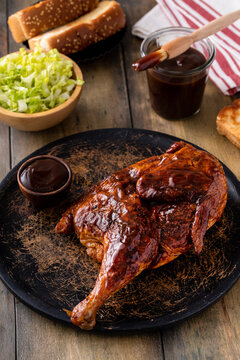 Barbeque smoked half chicken with salad and toast