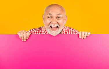 amazed senior man with copy space on blank banner. advertising