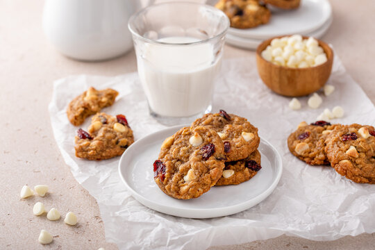 White chocolate and cranberry cookies on a white plate