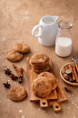 Fototapeta na wymiar Cinnamon cookies on wooden board with milk