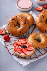 Variety of bagels served with strawberry cream chees and fresh berries