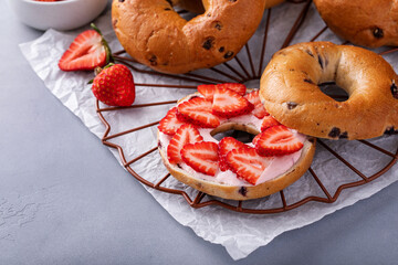 Variety of bagels served with strawberry cream chees and fresh berries