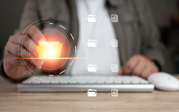 Man hand transferring files in virtual screen for sent document. Data transfer, Transfer file of data between folders, backup data. Document Management System DMS. Touch file folder with pen