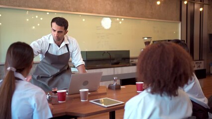 Group of barista or bartender students having a workshop how to brew and test coffee with professional - expert barista.