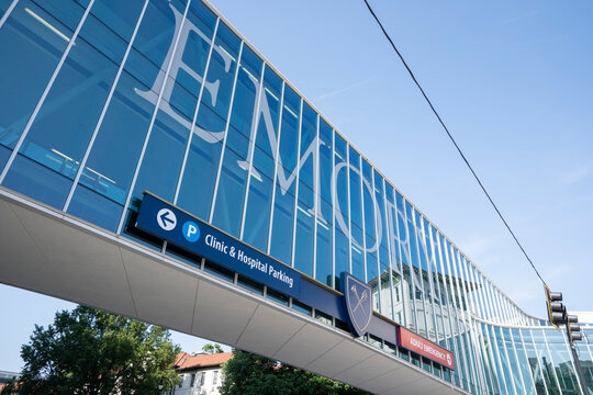 Atlanta, GA, USA - June 15, 2022: Emory sign is seen on the pedestrian bridge concourse connecting Emory University Hospital with the new hospital tower, Emory Clinic, and Winship Cancer Institute.
