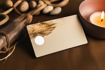 A mock-up of a spa gift card and candle light. Spa still life concept