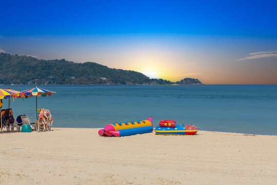 Patong Beach Phuket Thailand nice white sandy beach clear blue and turquoise waters and lovely blue skies with Palms tree