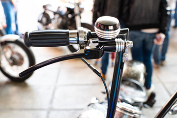 handlebar of steering wheel of chromium plated vehicle with hand brake