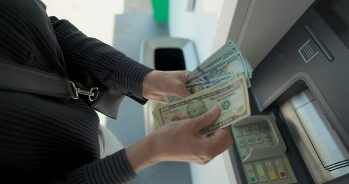 Business woman counting us dollars near ATM machine  Generative AI