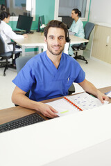 Fototapeta premium handsome young doctor in hospital reception