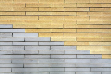 Brick wall with gray and yellow brickwork