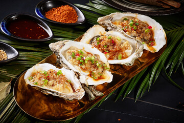 Oysters and Rice Noodles,BBQ food, indoor shot, dark tabletop background