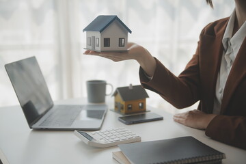 Real estate broker agent presenting and consult to customer to decision making sign insurance form...