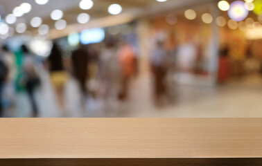 Empty dark wooden table in front of abstract blurred bokeh background of restaurant . can be used for display or montage your products.Mock up for space.