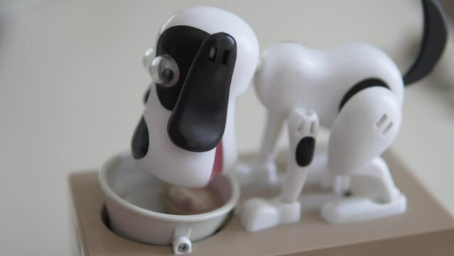 Funny electric piggy bank, a dog eats coins from a saucer Generative AI