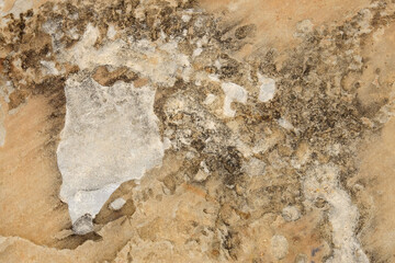 texture of a stone wall with cracks, background and a shadow