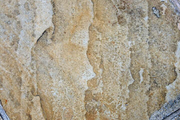texture of a stone wall with cracks, background and a shadow
