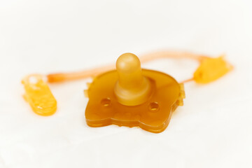 silicone baby pacifier on bed