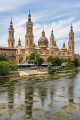 Fototapeta na wymiar Impressive monument of the cathedral basilica del Pilar on the edge of the river Ebro in Zaragoza, Spain.