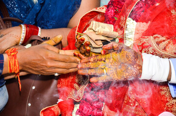 hands of a woman with henna