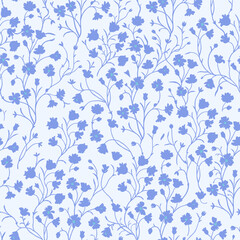 Spring floral pattern of blue flowers on a blue background.