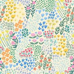 A pattern of abstract bright spring and summer flowers on a light green background.
