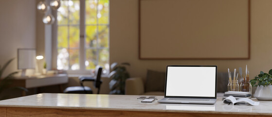 Modern comfortable workspace with blank screen laptop and copy space on white table.