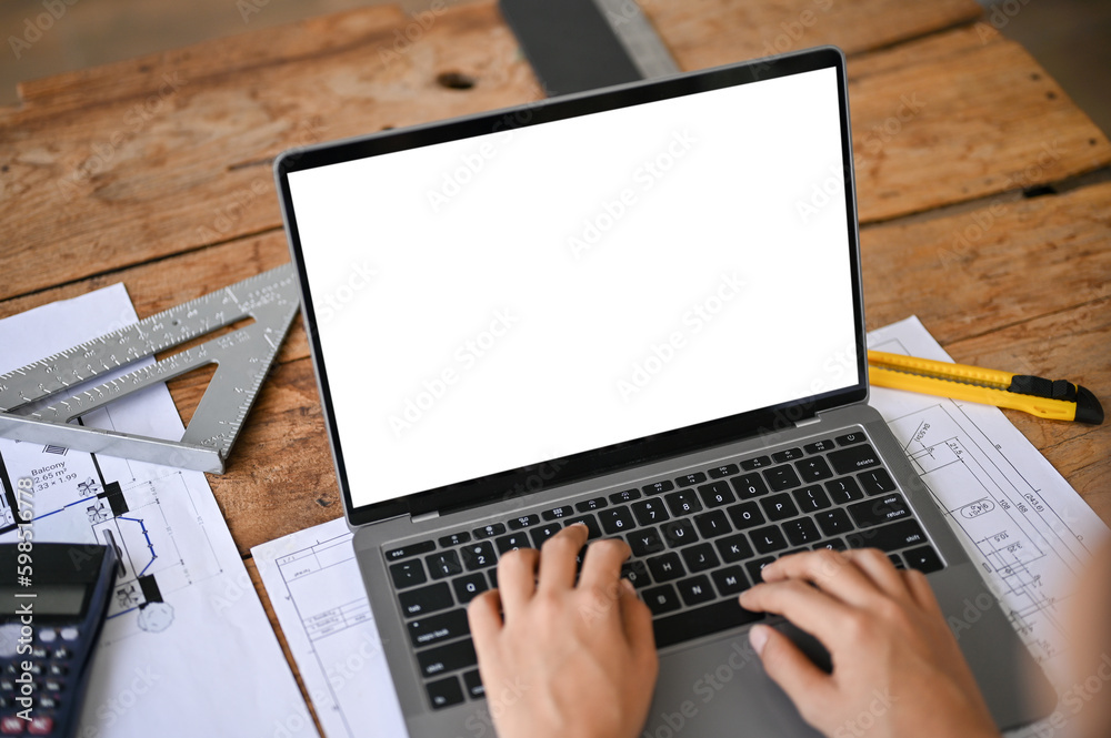 Canvas Prints close-up image of a professional female engineer or architect using laptop in the office.